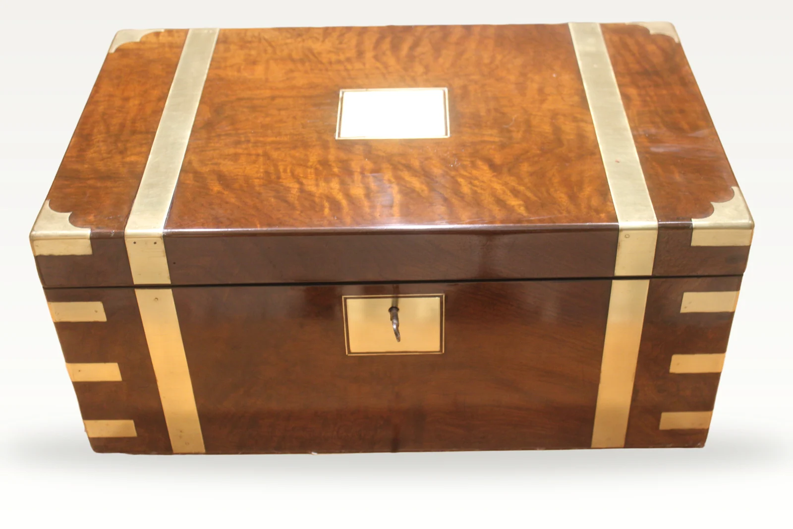 A large and impressive figured walnut and brass bound writing slope with secret