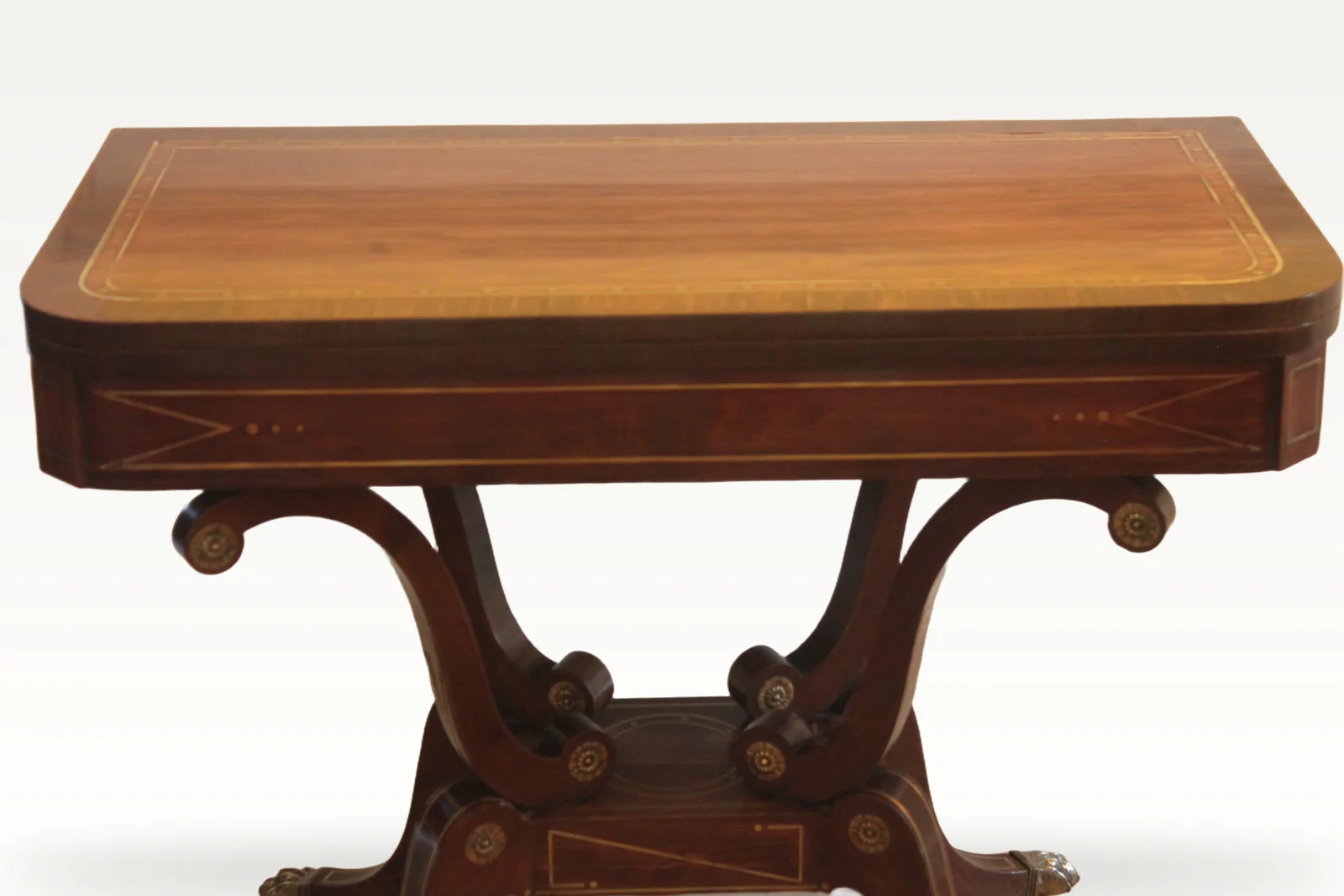 A fine Regency period mahogany brass inlaid fold-over card table