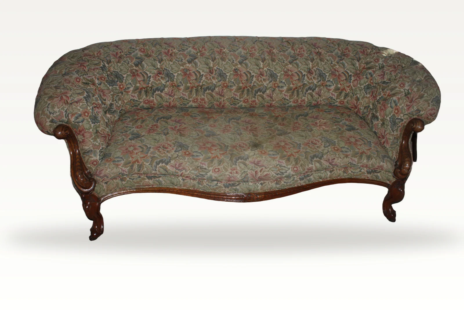 A wonderful and rare Antique Victorian original carved walnut chesterfield sofa.