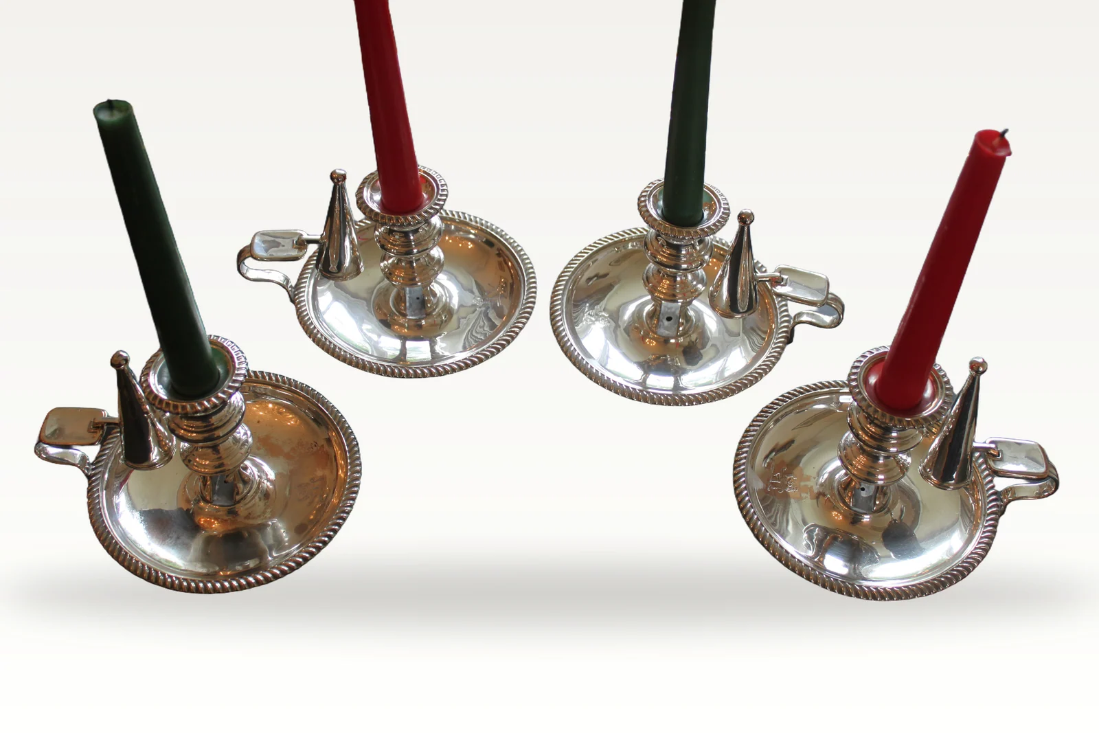 A rare set of four early 19th century silver plated chamber sticks