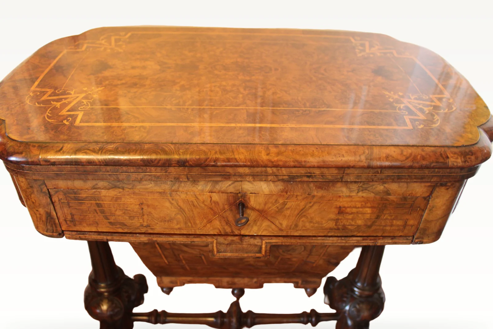 A Victorian burr walnut games sewing table — view 2