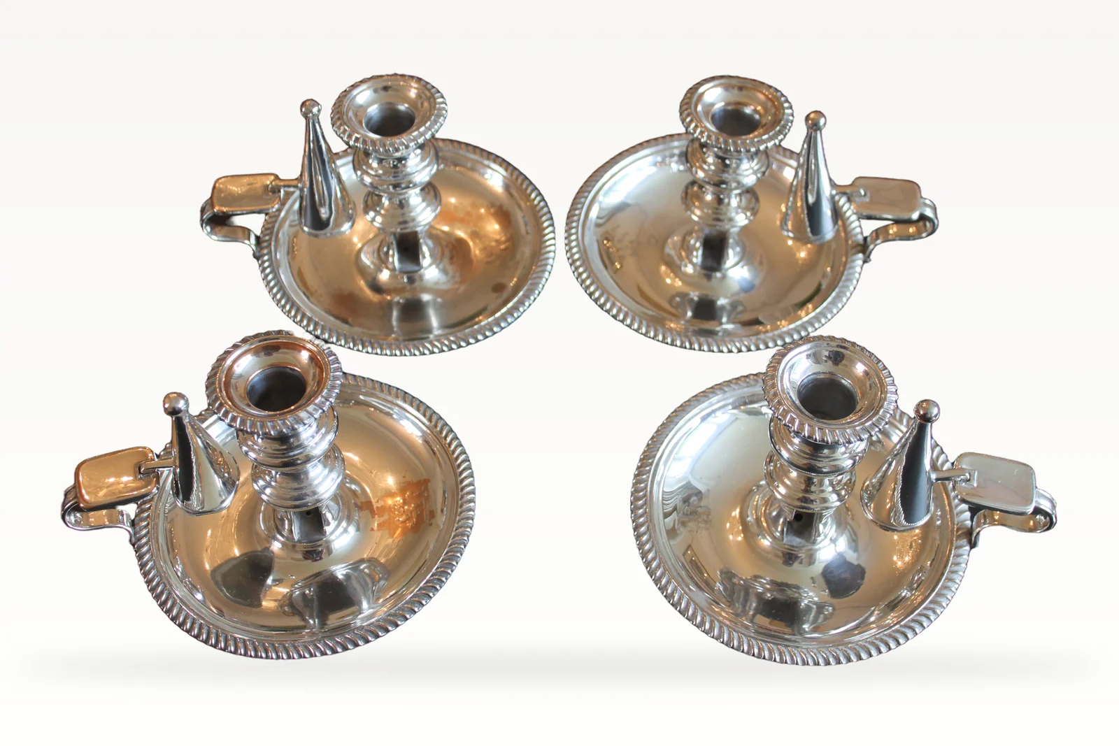 A rare set of four early 19th century silver plated chamber sticks — view 2