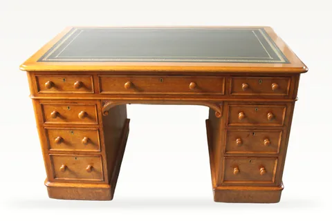 Victorian oak nine drawer pedestal desk by Edwards & Roberts
